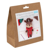 Amigurumi Crochet Kit in a brown kraft paper bag package, featuring a printed front label with a photo of a crocheted reindeer doll 