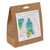 Amigurumi crochet kit packaging with a blue and green crochet jellyfish on a white background