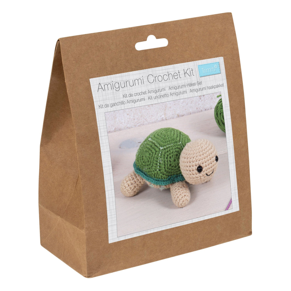Amigurumi crochet kit packaging with a tortoise on a white background