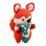 A crocheted plush fox toy in bright orange-red, cream, and teal, standing against a plain white background.