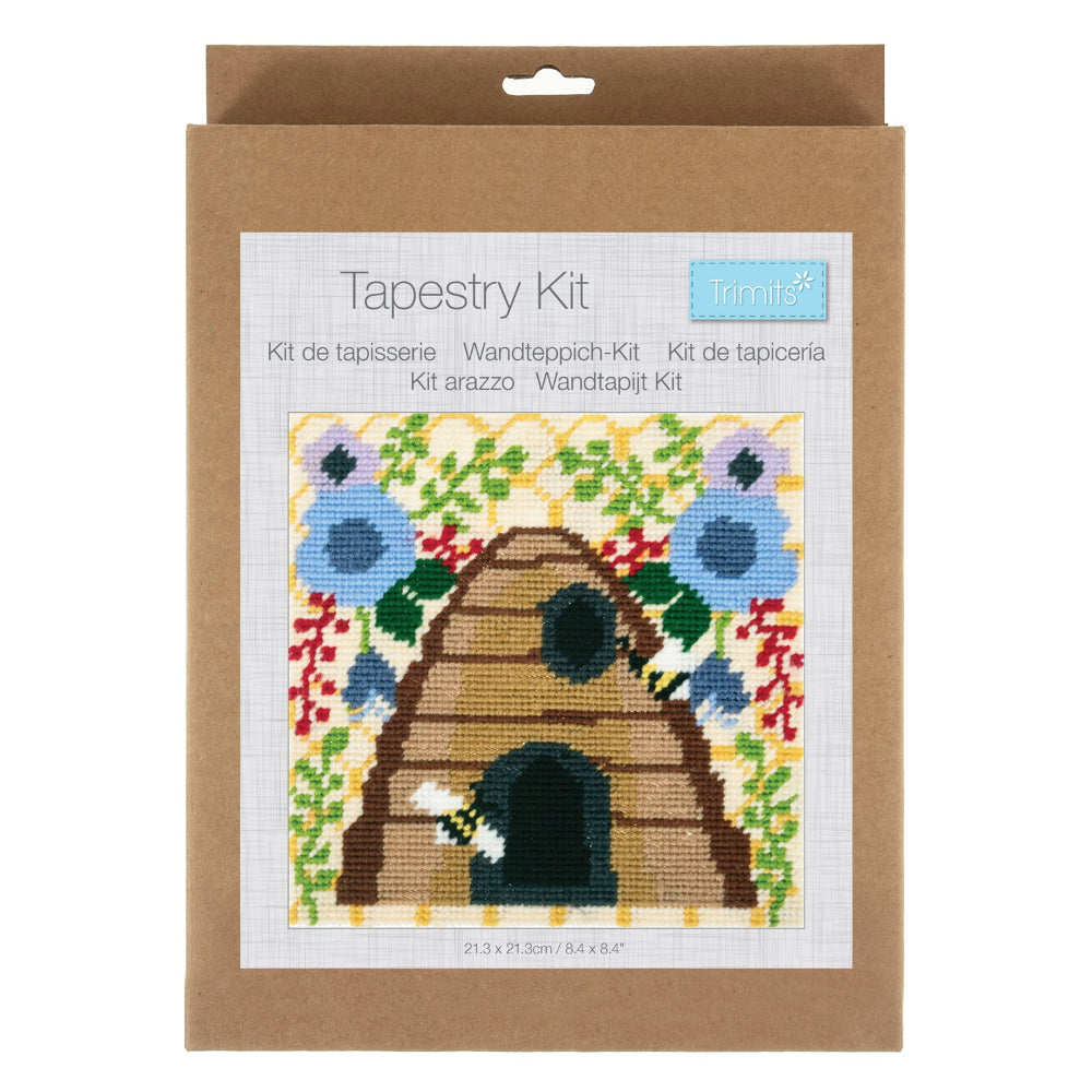 Tapestry kit packaging with a beehive design on a white background