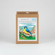 Tapestry kit with a bird design on a white background