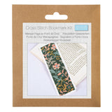A cross stitch bookmark kit in a brown kraft paper hanging card package. The front label shows the text 'Cross Stitch Bookmark Kit' and a photo of a completed patterned bookmark placed over an open book.