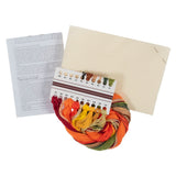 Cross stitch kit with a multicolour thread skein, a cream-colored canvas, a colour reference chart, and an instruction booklet on a white background.