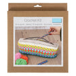A packaged crochet kit in a brown cardboard sleeve with a front photo showing a crocheted zip pouch and crochet hooks. The package text reads 'Crochet Kit' and includes a small blue 'trimit' brand label.