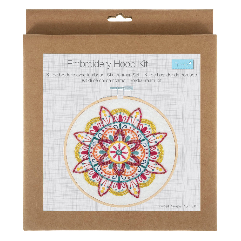 Embroidery Hoop Kit in its original brown kraft paper packaging, featuring a colorful mandala design on the front label.