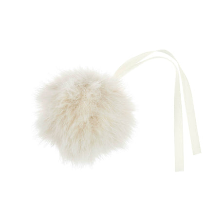 A fluffy cream faux fur pom-pom ornament with a matching cream ribbon tail, shown on a solid white background.