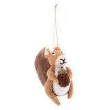 A felted wool squirrel hanging ornament holding an acorn, crafted in natural brown, cream, and white wool with a tan hanging string.