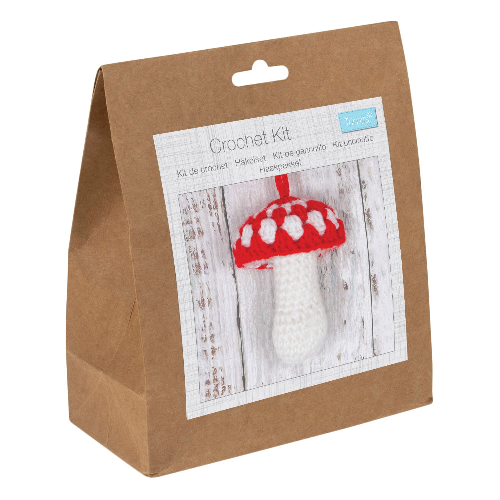 Crochet kit packaging with a picture of a crocheted mushroom on a white background