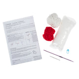Crochet kit with yarn, hooks, and instructions on a white background