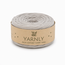 A roll of Yarnly faux leather T-shirt yarn in a light gray color, wrapped in a kraft paper band with the brand name 'YARNLY' printed on it, set against a plain white background.