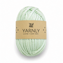 A ball of pale mint green yarn wrapped with a brown paper label that reads 'YARNLY LUSTRE T-SHIRT YARN' on a white background.