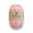 A skein of Yarnly Lustre T-Shirt Yarn in a soft pink color with subtle shimmer, wrapped in a brown paper label, on a white background.