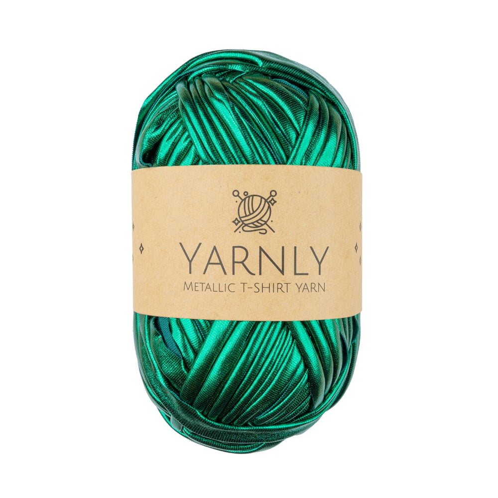 A ball of metallic emerald green T-shirt yarn with a kraft paper label reading 'YARNLY METALLIC T-SHIRT YARN' on a plain white background.