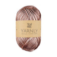 Ball of metallic rose gold yarn with Yarnly label on a white background