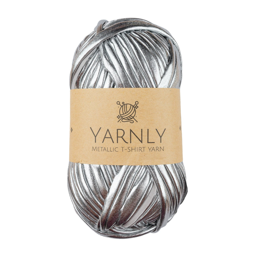 A skein of metallic silver t-shirt yarn with a brown paper label reading 'YARNLY METALLIC T-SHIRT YARN' on a plain white background.