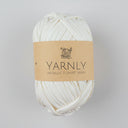 Ball of white yarn with a brown label on a white background
