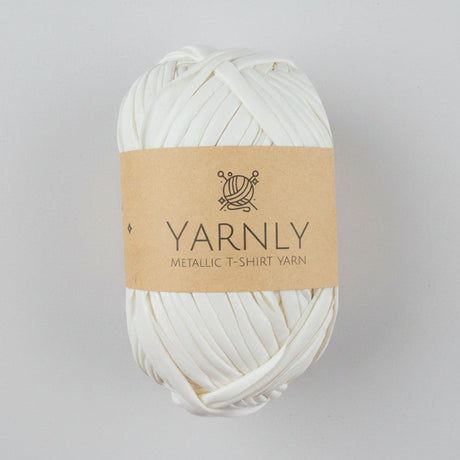 Ball of white yarn with a brown label on a white background