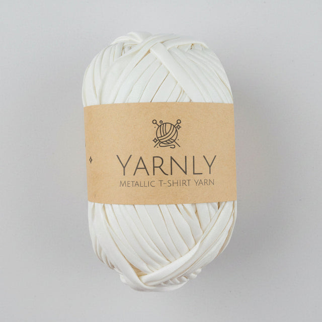 Ball of white yarn with a brown label on a white background
